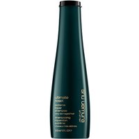 Dark green Shu Uemura Ultimate Reset Shampoo bottle, 300ml, with gold text and sleek, tapered design.