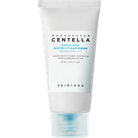 White tube of SKIN1004 Madagascar Centella Hyalu-Cica Sun Serum with blue text, SPF50+ PA++++, 15 ml.