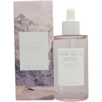 Clear bottle of Skin1004 Madagascar Centella Poremizing Fresh Ampoule with dropper, pink box with mountain design.