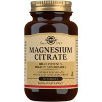Brown bottle of Solgar Magnesium Citrate tablets with gold cap and beige label detailing high potency and vegan suitability.