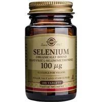 Brown glass bottle of Solgar Selenium 100µg, gold cap, beige label with black and red text, 100 tablets supplement.