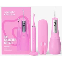 Spotlight pink Sonic Pro toothbrush and UV water flosser set with sleek design and matching travel case.
