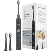 Spotlight Sonic Toothbrush in graphite grey with sleek handle, two extra brush heads, and branded packaging.