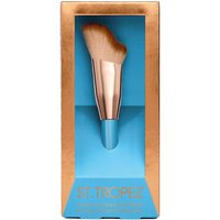 St. Tropez face brush with rose gold handle and soft, angled bristles in a blue and copper packaging.