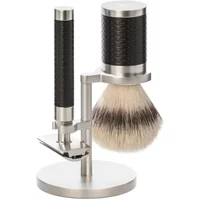 Stainless steel safety razor kit with black textured handles, shaving brush, and stand by Mühle Rocca.