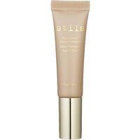 Stila Aqua Glow Serum Concealer in Deep, beige tube with gold cap and stila logo in gold lettering.