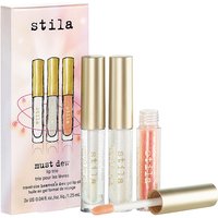Stila Must Dew Lip Trio with two clear gloss tubes, one peach gloss tube, and gold caps, next to illustrated box.