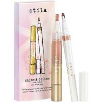 Stila Shine & Define Nude Lip Duo with gold and white tubes, brush applicator, and pink packaging.