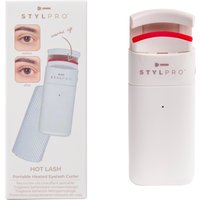 StylPro Heated Eye Lash Curler in white with red silicone pad, shown next to packaging displaying usage instructions.