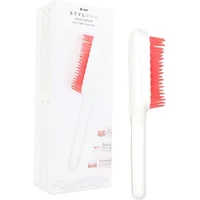 Stylpro Root Renew white hair brush with red bristles and sleek handle, shown next to its packaging box.