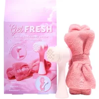 Pink facial cleaning brush and fluffy headband set with matching pink packaging.