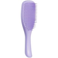 Purple Tangle Teezer detangling brush with curved handle and flexible bristles for curly hair.