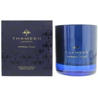 Thameen Imperial Plum Candle 250g in a deep blue glass jar with gold lettering, next to a matching box.