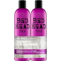 Purple TIGI Bed Head Dumb Blonde Shampoo & Conditioner bottles with black caps, 750ml each, for blonde hair.