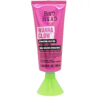 Pink tube of TIGI Bed Head Wanna Glow Hydrating Jelly Oil 100ml with green cap and bold black text.