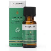 Brown glass bottle with black cap, green label reading "Tisserand Tea Tree Organic Essential Oil 20ml," next to matching box.
