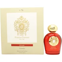 Red Tiziana Terenzi Wirtanen perfume bottle with gold cap, next to cream box with ornate gold emblem.