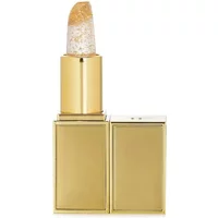 Gold Tom Ford Soleil Lip Blush with clear, shimmering balm and gold flecks in a sleek rectangular case.