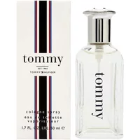 Clear glass bottle with silver cap, "tommy" text, next to white box with red, white, and blue stripes, 50ml.