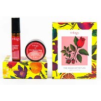 Trilogy The Rosehip Ritual set with vibrant floral packaging, includes a serum roller, cream jar, and decorative box.