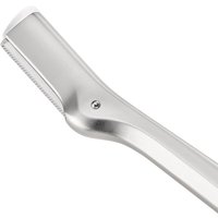 Silver Tweezerman Brow Razor with a sleek handle and protective blade cover.