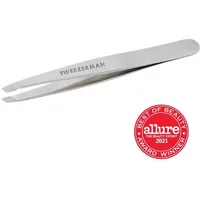 Silver Tweezerman Slant Tweezer with angled tips and engraved logo, next to a red Allure Best of Beauty 2021 badge.