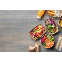 Two-Week Healthy Meal Plan PDF cover with colorful meals in bowls, juice bottle, and wooden cutlery on a gray table.