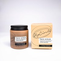 UpCircle Coffee Face Scrub in brown jar with black lid, citrus blend label, next to matching beige box.