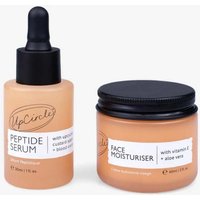 Peach-colored UpCircle Peptide Serum with dropper and Face Moisturiser in jar, black lids, white labels.