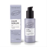 Purple UpCircle Hair Serum bottle with pump, featuring fermented rice water and baobab, next to matching box.