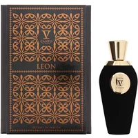 Black V Canto Leon perfume bottle with gold cap, next to ornate black and gold patterned box.