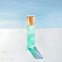 Valmont Bi Falls 60ml bottle with gold cap, translucent turquoise liquid, and elegant branding.
