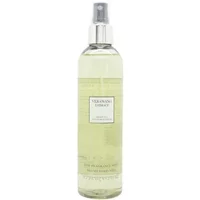 Vera Wang Embrace body mist, clear bottle with silver cap, light green liquid, 240ml label.