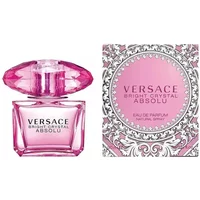 Pink Versace Bright Crystal Absolu perfume bottle with faceted cap next to ornate pink and silver box.
