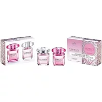 Versace gift set with two pink perfume bottles, Bright Crystal and Bright Crystal Absolu, in elegant packaging.