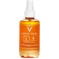 Orange Vichy Capital Soleil SPF 50+ spray bottle with white pump, 200ml, labeled "Solar Protective Water Enhanced Tan."