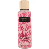 Victoria's Secret Pure Seduction Shimmer Body Mist, pink bottle with gold cap and bold red script.