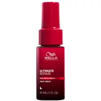 Red Wella Professionals Ultimate Repair Night Serum bottle, 30ml, with pump dispenser and white text.