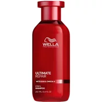 Red Wella Ultimate Repair Shampoo bottle, 250ml, with white logo and text, featuring a sleek cylindrical design.