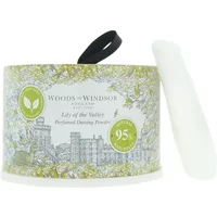 Woods of Windsor Lily Of The Valley Dusting Powder, floral design, green accents, round container with black ribbon handle.