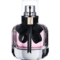 Clear glass bottle with pink perfume, black ribbon bow, and YSL gold logo on neck.