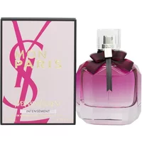 Yves Saint Laurent Mon Paris Intensement perfume, pink gradient bottle with black bow, next to matching box.