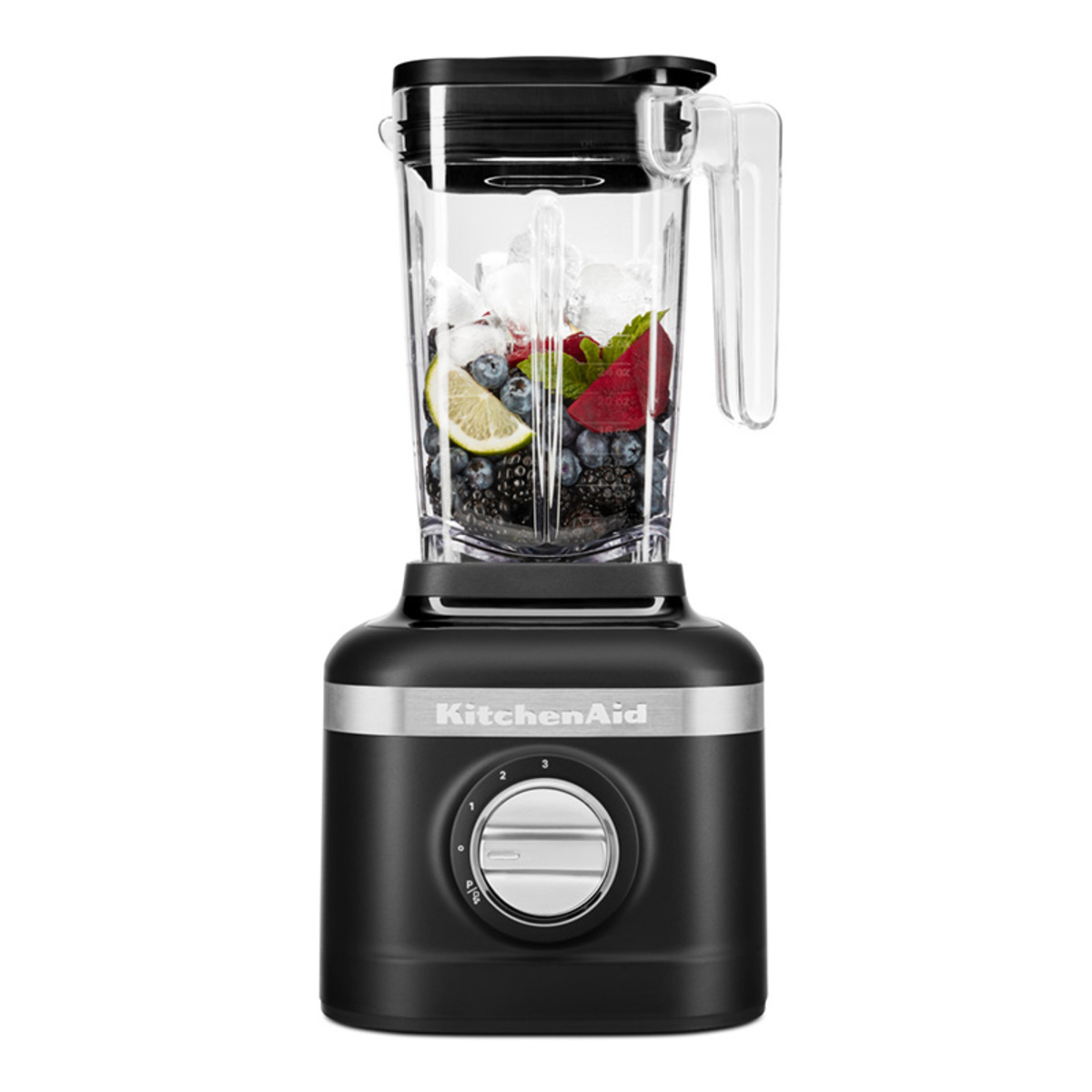 Matte black KitchenAid K150 blender with a transparent pitcher filled with ice, berries, and lemon slices, featuring a silver control dial on the base.