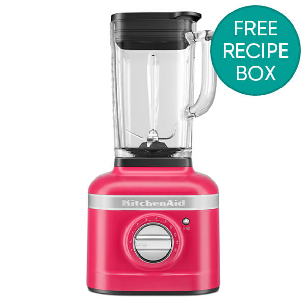 Bright hibiscus pink 1.4L KitchenAid K400 Artisan Blender features a clear blending jar, a black lid, and a silver control dial, with a promotional "Free Recipe Box" badge.