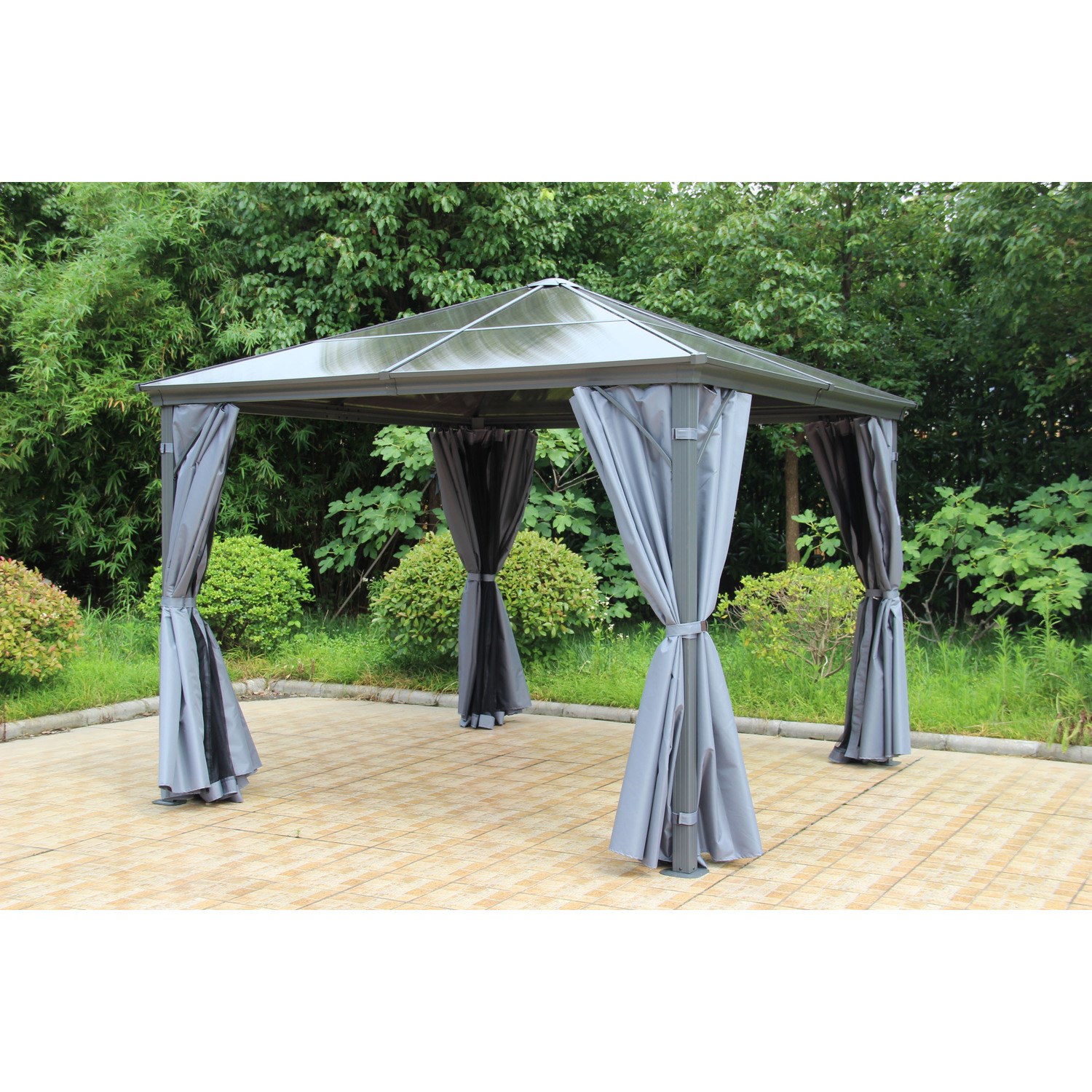 A 10' x 10' grey polycarbonate garden gazebo featuring a peaked roof, draped grey curtains, and a sturdy frame, set against a lush green backdrop.
