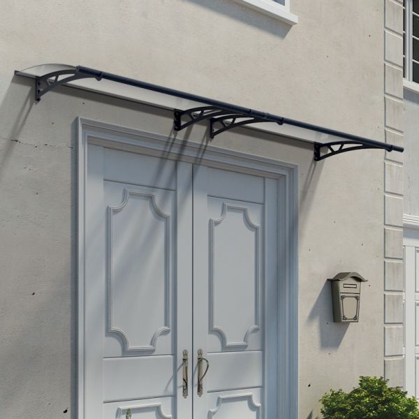 Grey door canopy with a sleek design, measuring 10' x 3', featuring a durable polycarbonate top and sturdy metal brackets, mounted above double doors on a light-colored wall.