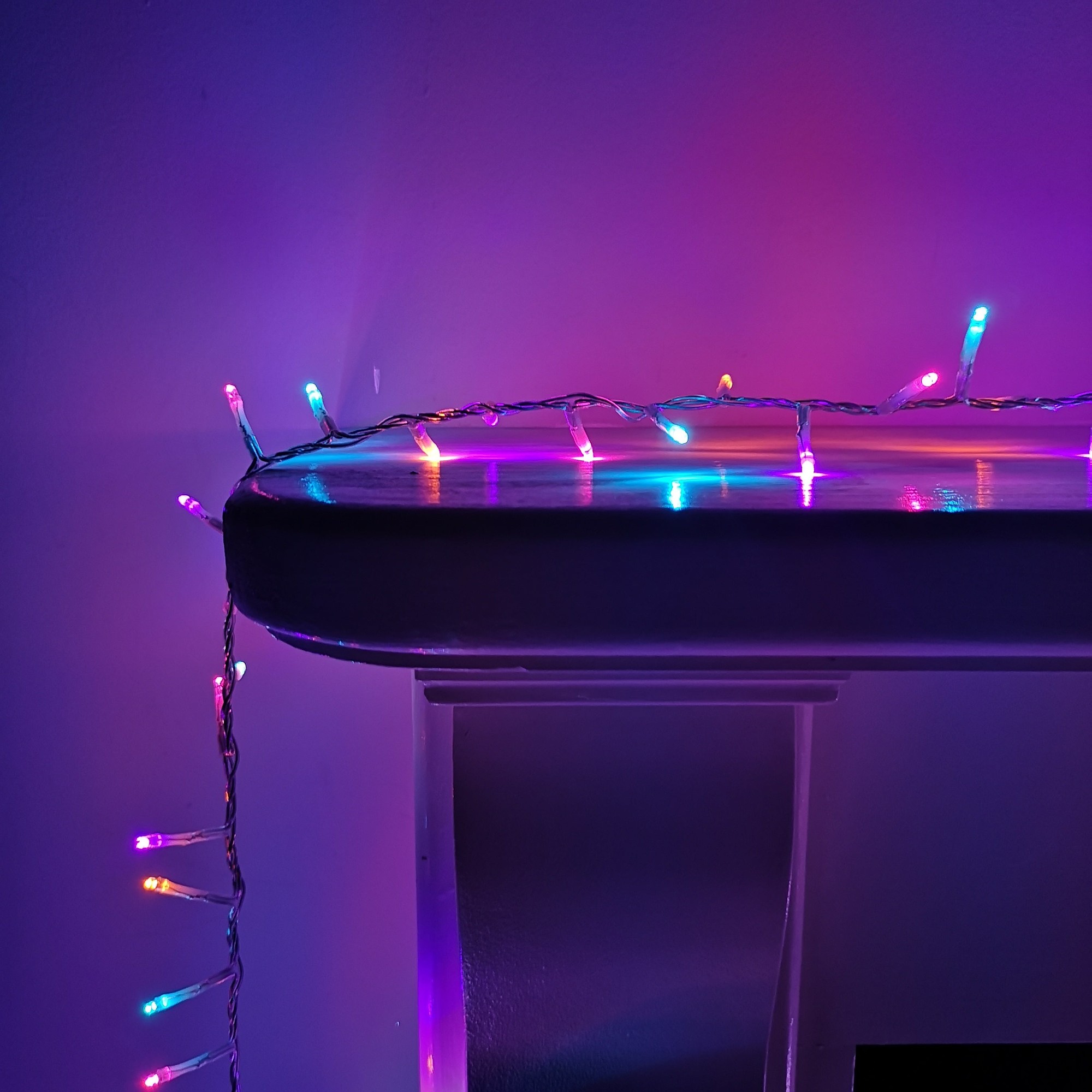 Multi-function string lights with a clear cable, featuring vibrant multi-coloured LEDs, suitable for indoor and outdoor use, with a timer function for convenience.