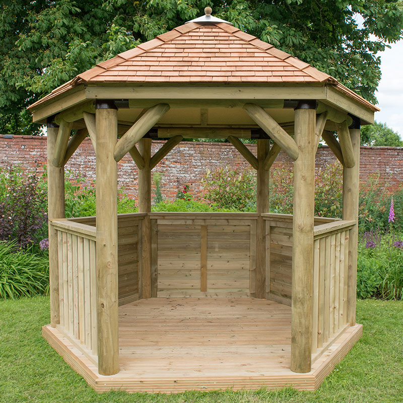 Luxury wooden garden gazebo with a New England cedar roof, featuring a hexagonal shape, sturdy timber posts, and a spacious interior, seating up to 10 people.
