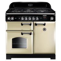 Classic 100cm dual fuel range cooker in cream with chrome trim, featuring a five-burner gas hob, two ovens, and stylish black control knobs.