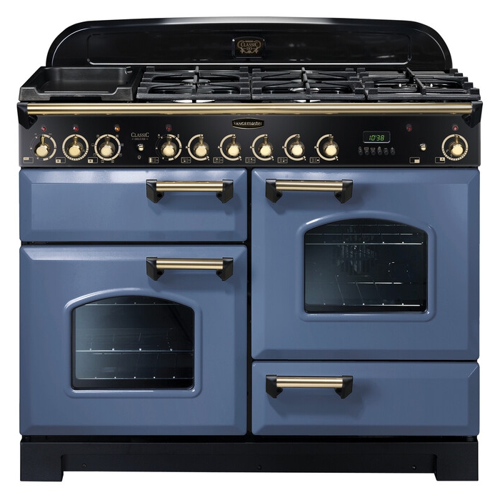 Classic Deluxe 110cm dual fuel range cooker in stone blue with brass trim, featuring five gas burners, two ovens with glass doors, and a sleek black control panel.